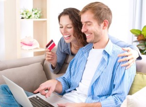 16472458 - young couple with laptop and credit card buying online