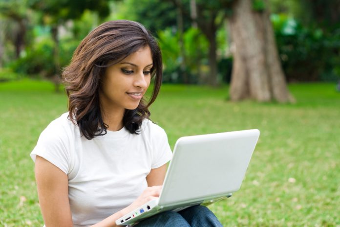 Woman Using Laptop Outdoors
