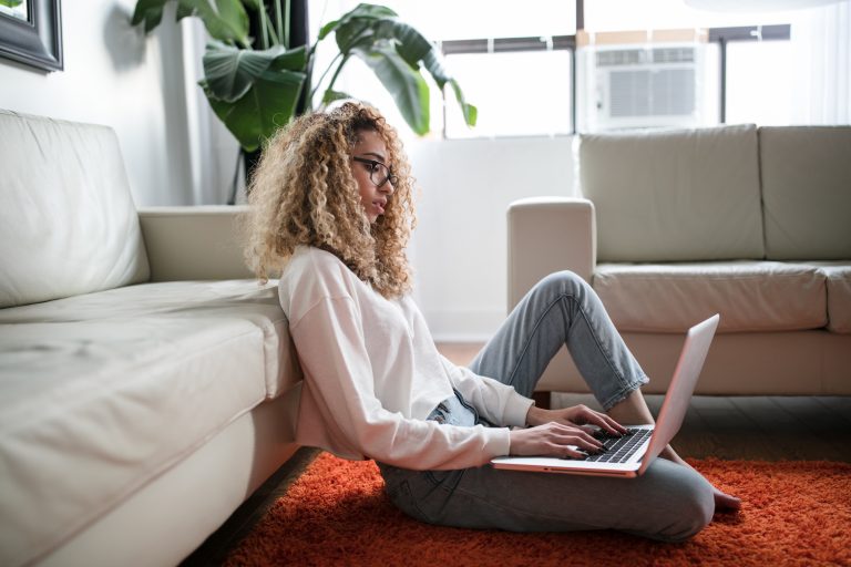 Woman working in living room