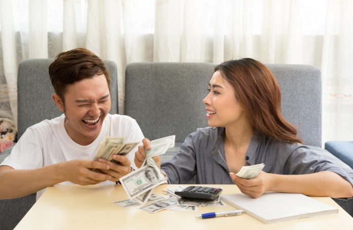 Young couple organizes their finances.