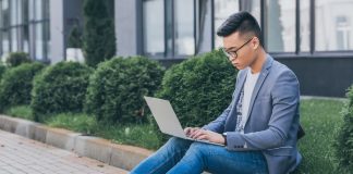 Man working on laptop outside