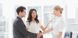 Businesswoman introducing colleagues in the office