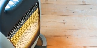 A halogen or electric heater on wooden floor