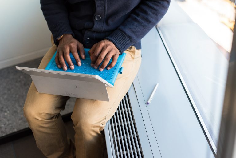 Man typing on laptop