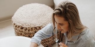 Woman sitting on the floor and working at her laptop