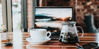 Table with laptop and coffee cup