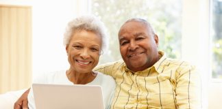 Senior couple using laptop