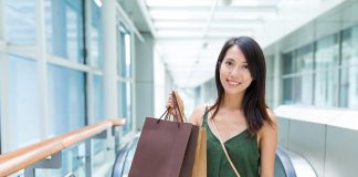 Woman holding shopping bags in the mall