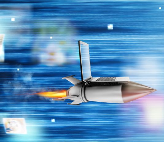 Fast internet concept with a laptop over a speedy rocket