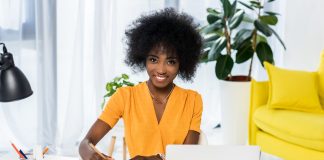 Cheerful woman working in her office