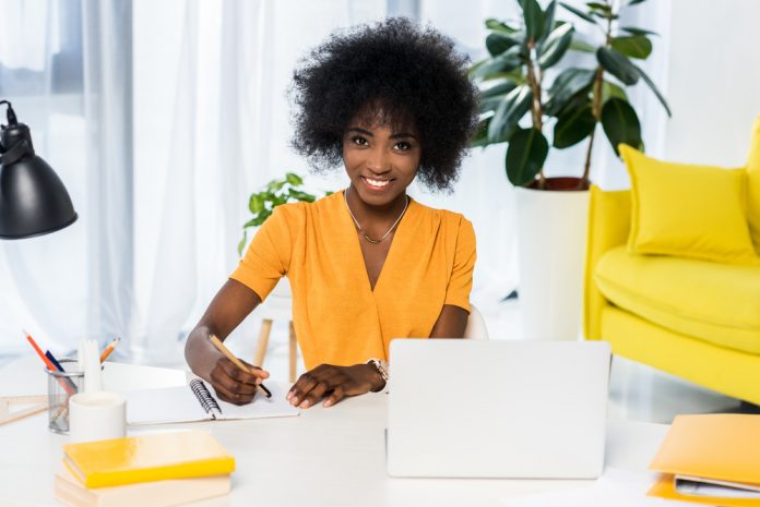 Cheerful woman working in her office
