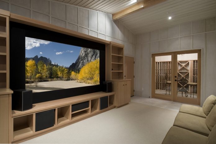 Home theater with wine tasting room, big screen, wood cabinets