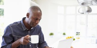 Man Using Laptop At Home