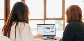 Two women working on laptop