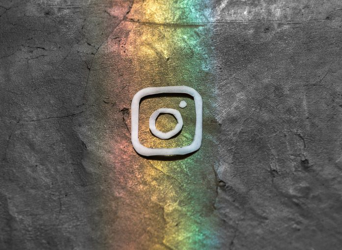 Instagram logo against rainbow background