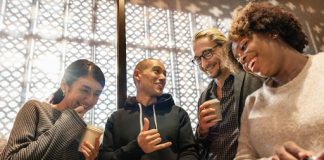 Group of people smiling at phone