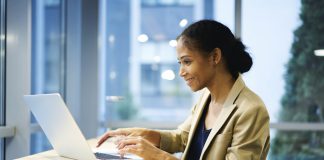 Female sitting and working at laptop