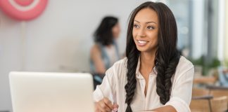 Businesswoman with laptop at cafe