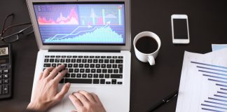 Man working on trades at table in office