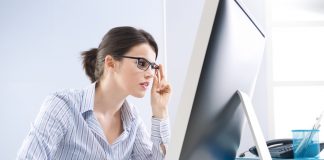 Office worker staring at computer screen