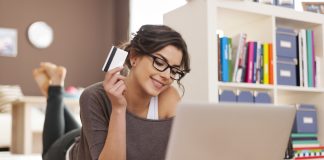 Happy woman doing online shopping at home