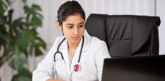 Doctor wearing a white coat with stethoscope