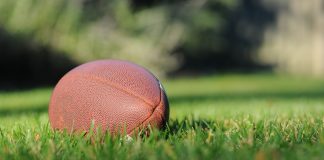 Football on green field