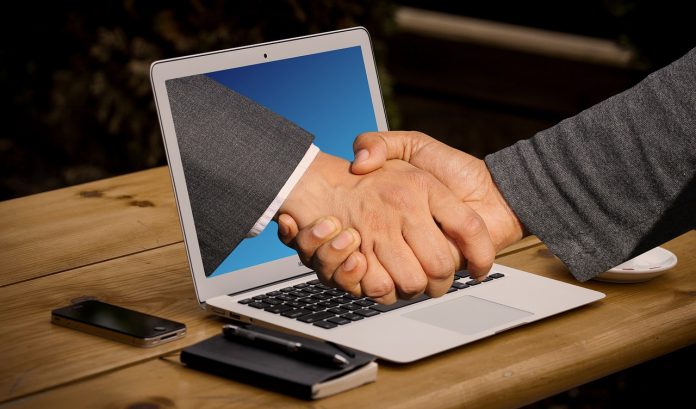 Handshake through a laptop