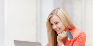 Businesswoman with laptop and credit card