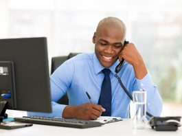 Happy businessman talking on phone