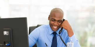 Happy businessman talking on phone