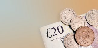 Twenty pounds and pence coins isolated on background