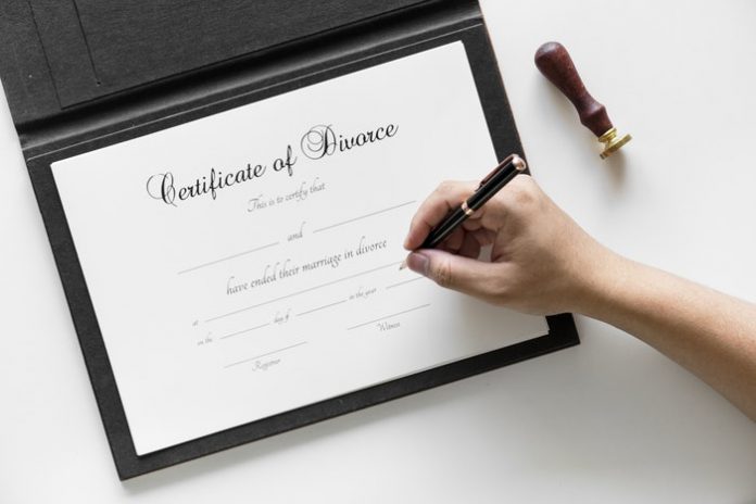 Person signing divorce certificate