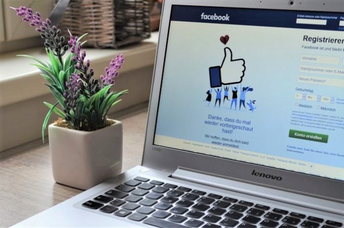 Facebook page open on laptop computer