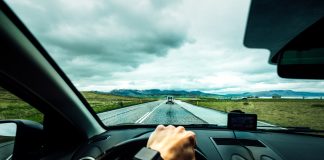 Person driving car on road