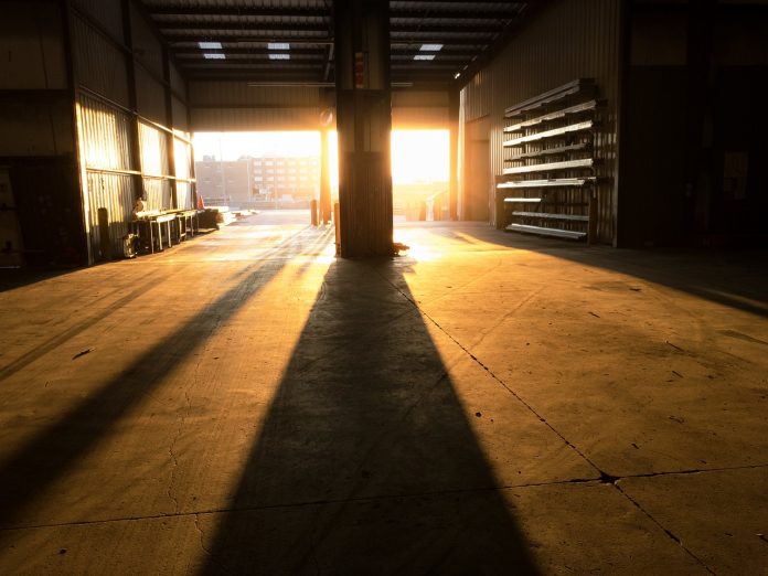 Warehouse lit with light from setting sun