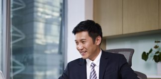 Businessman working on laptop in office