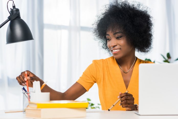 Smiling freelancer at workplace at home