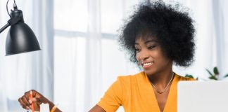 Smiling freelancer at workplace at home