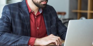 Businessman working with laptop at office