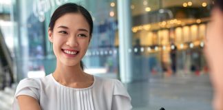 Businesswoman shaking hands in modern city work office