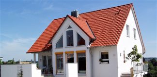 Red roof on white house