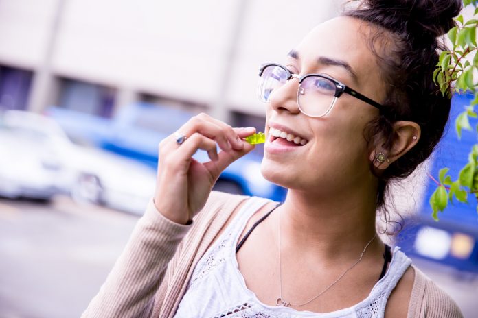 Woman eating CBD candy