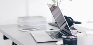 Desk with laptop and work items