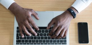 Man typing on laptop