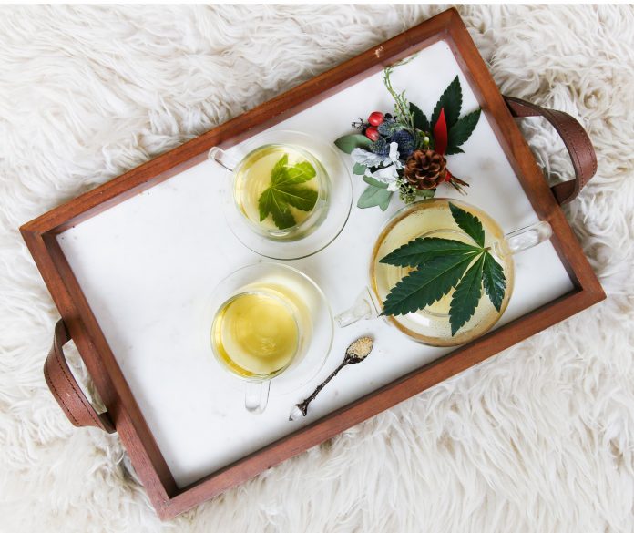 CBD oil artfully arranged on tray