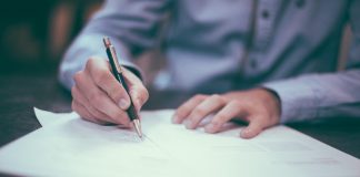 Man writing on document