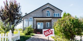 House with sold sign