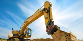 Big excavator in front of the blue sky