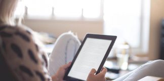 Woman reading on tablet